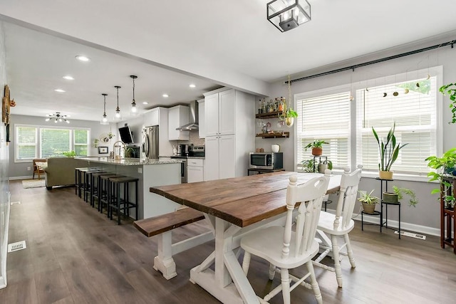 920 S Washington St, Independence, MO 64050 - dining area with recessed lighting, light wood-style flooring, and baseboards
