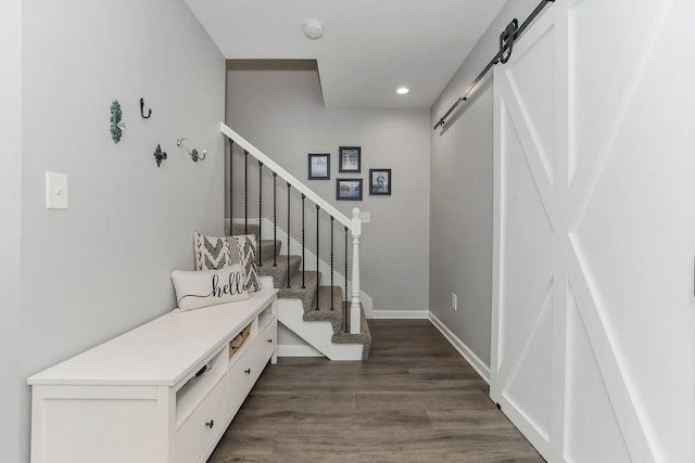 920 S Washington St, Independence, MO 64050 - entrance foyer with a barn door, dark wood finished floors, recessed lighting, stairway, and baseboards