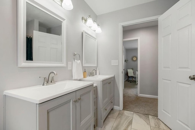 920 S Washington St, Independence, MO 64050 - full bathroom featuring two vanities and baseboards