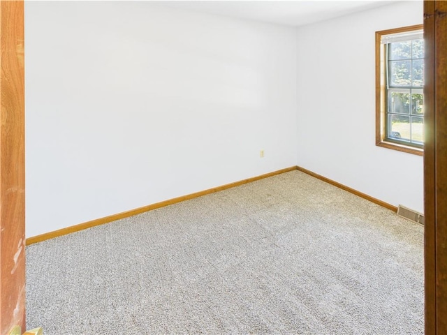240 SE 121st Rd, Warrensburg, MO 64093 - carpeted spare room featuring baseboards