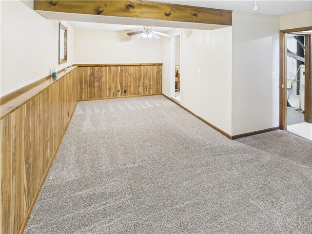 240 SE 121st Rd, Warrensburg, MO 64093 - basement with light carpet, ceiling fan, and wood walls