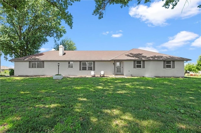 22617 155th St, Basehor, KS 66007 - rear view of house with a lawn and a chimney