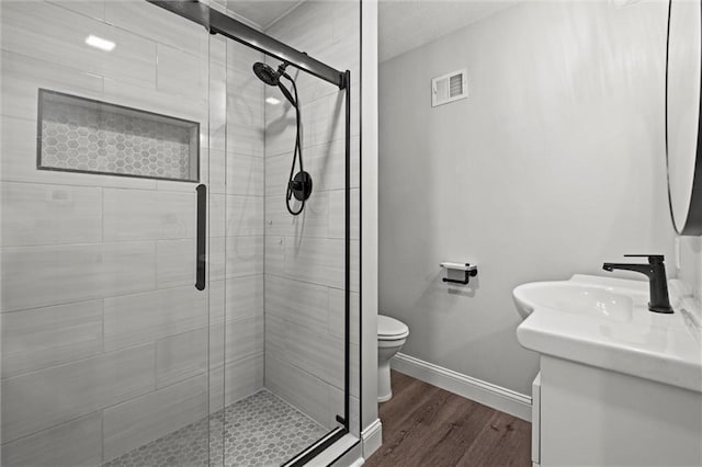 22617 155th St, Basehor, KS 66007 - bathroom with vanity, wood finished floors, and a shower stall