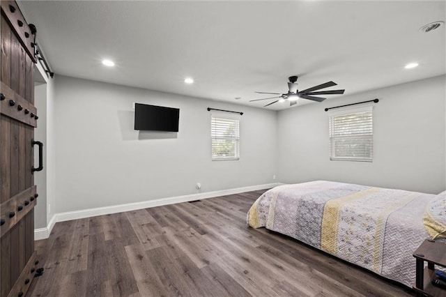 22617 155th St, Basehor, KS 66007 - bedroom with a barn door, dark wood-style flooring, recessed lighting, and ceiling fan
