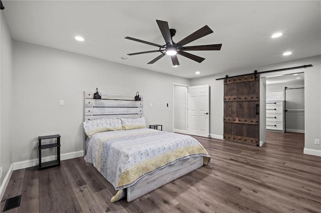 22617 155th St, Basehor, KS 66007 - bedroom featuring a barn door, wood finished floors, recessed lighting, and a ceiling fan