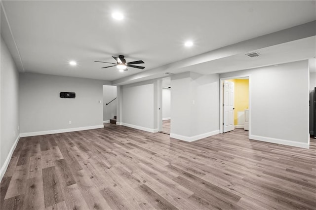 22617 155th St, Basehor, KS 66007 - finished basement featuring recessed lighting, wood finished floors, stairs, a ceiling fan, and fridge