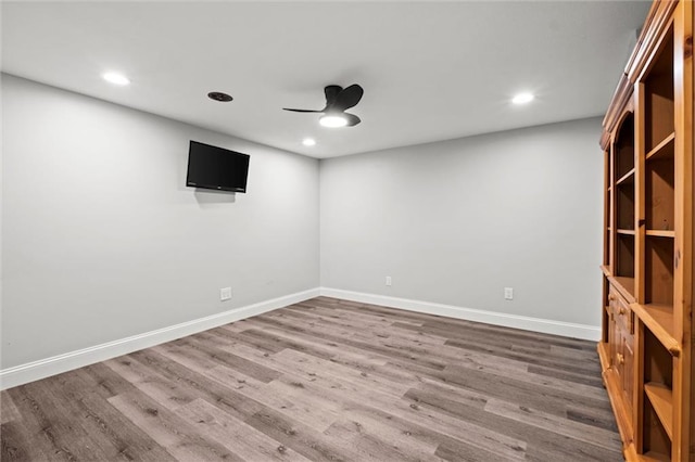 22617 155th St, Basehor, KS 66007 - spare room with wood finished floors, ceiling fan, and recessed lighting