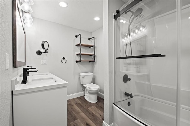 22617 155th St, Basehor, KS 66007 - bathroom with combined bath / shower with glass door, wood finished floors, double vanity, and recessed lighting