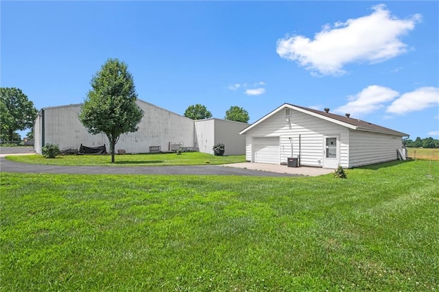 22617 155th St, Basehor, KS 66007 - view of grassy yard with an outbuilding and a detached garage