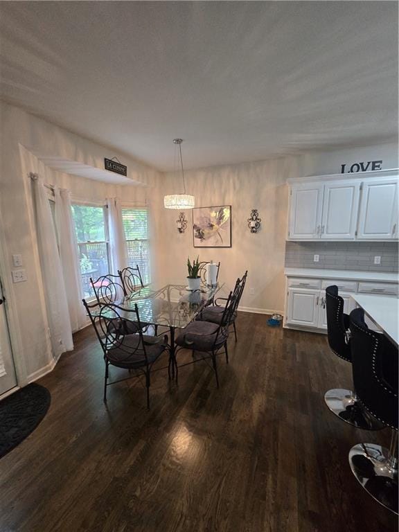 13810 W 53rd St, Shawnee, KS 66216 - dining area with dark wood-style floors and baseboards