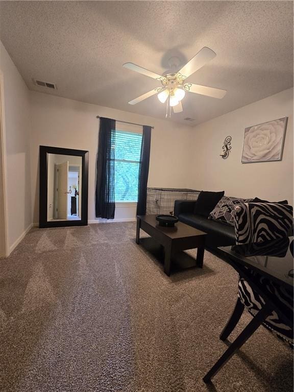 13810 W 53rd St, Shawnee, KS 66216 - carpeted living area featuring a textured ceiling, a ceiling fan, and baseboards