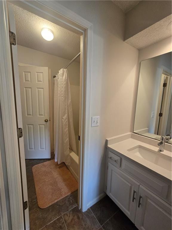 13810 W 53rd St, Shawnee, KS 66216 - bathroom with a textured ceiling, vanity, tile patterned floors, and shower / bathtub combination with curtain