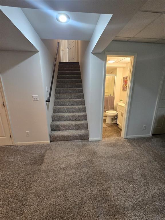 13810 W 53rd St, Shawnee, KS 66216 - staircase featuring carpet and baseboards