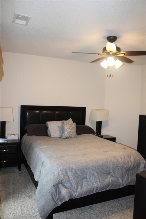 13810 W 53rd St, Shawnee, KS 66216 - carpeted bedroom featuring ceiling fan