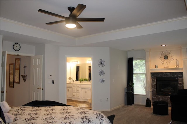 13810 W 53rd St, Shawnee, KS 66216 - bedroom with light colored carpet, a fireplace, ornamental molding, connected bathroom, and ceiling fan