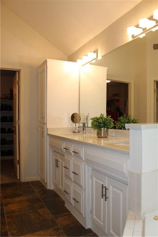 13810 W 53rd St, Shawnee, KS 66216 - bathroom with vaulted ceiling, vanity, and a spacious closet