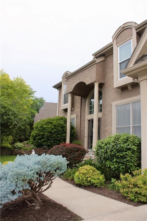 13810 W 53rd St, Shawnee, KS 66216 - property entrance featuring stucco siding