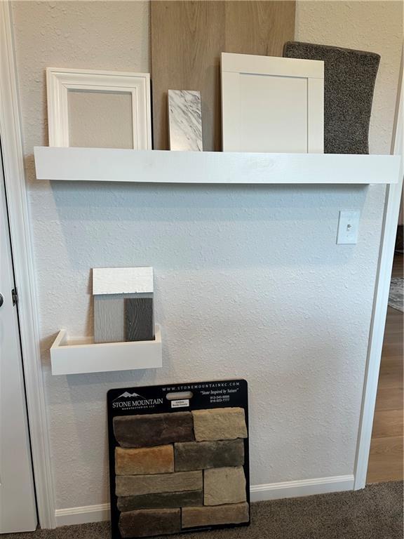 2133 Brook Ridge Cir, Tonganoxie, KS 66086 - detailed view of baseboards and carpet