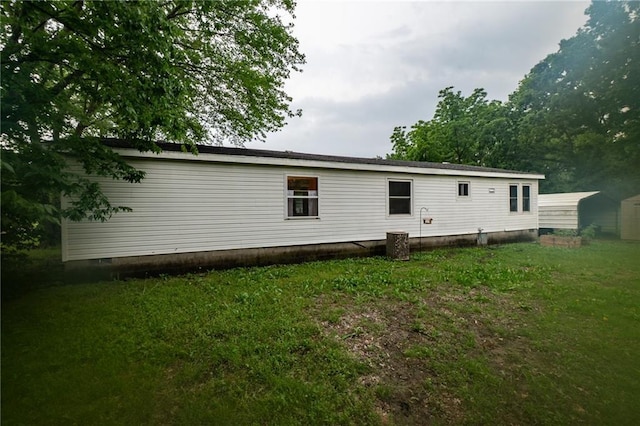 406 Cheyenne Ave, Coffeyville, KS 67337 - rear view of property with a yard and crawl space
