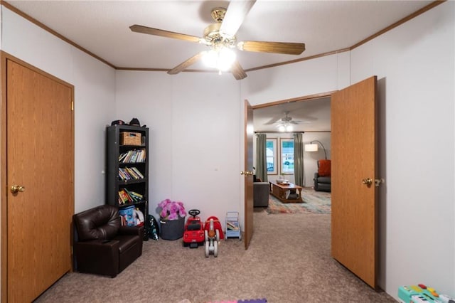406 Cheyenne Ave, Coffeyville, KS 67337 - playroom featuring crown molding, carpet flooring, and a ceiling fan
