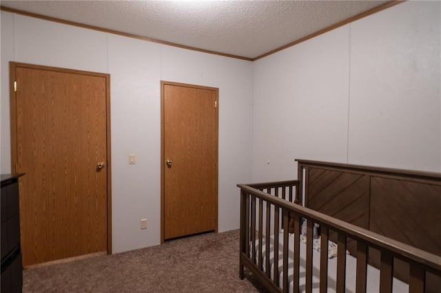 406 Cheyenne Ave, Coffeyville, KS 67337 - bedroom featuring carpet flooring, a textured ceiling, and crown molding