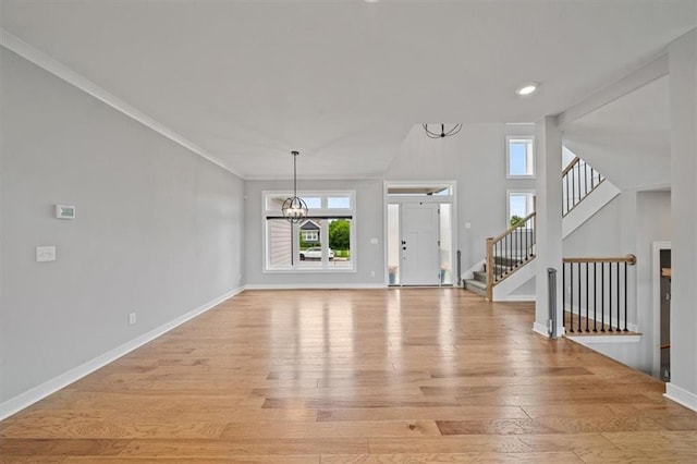 1709 SW Hightown Dr, Lees Summit, MO 64082 - entryway featuring a chandelier, light wood-style flooring, stairs, and recessed lighting