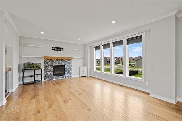 1709 SW Hightown Dr, Lees Summit, MO 64082 - unfurnished living room featuring crown molding, light wood-type flooring, a tile fireplace, and recessed lighting