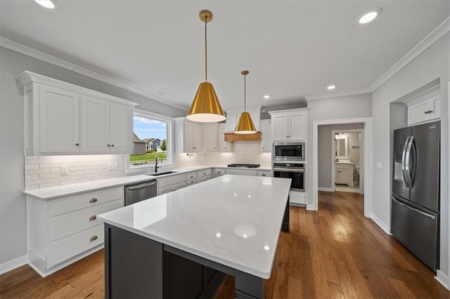 1709 SW Hightown Dr, Lees Summit, MO 64082 - kitchen with stainless steel appliances, backsplash, crown molding, a center island, and white cabinetry