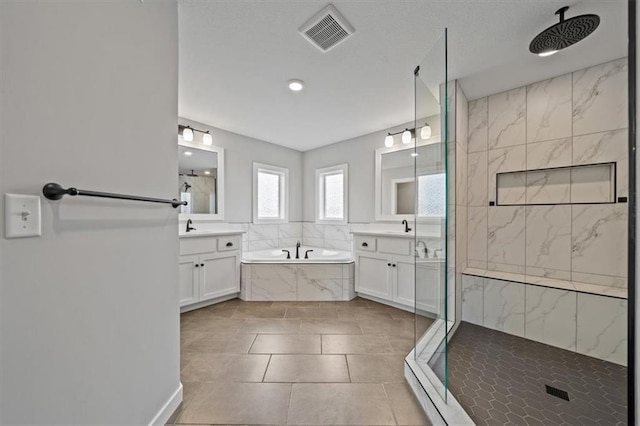 1709 SW Hightown Dr, Lees Summit, MO 64082 - full bath with a garden tub, a marble finish shower, two vanities, tile patterned floors, and recessed lighting