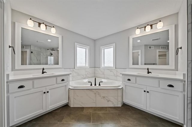 1709 SW Hightown Dr, Lees Summit, MO 64082 - full bath with two vanities, a bath, and tiled shower