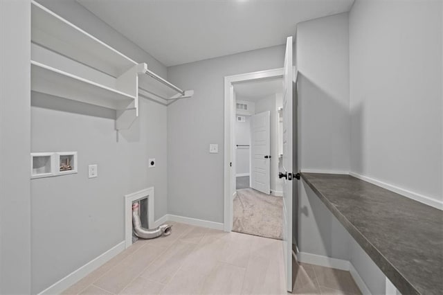 1709 SW Hightown Dr, Lees Summit, MO 64082 - washroom featuring electric dryer hookup, washer hookup, and light tile patterned floors