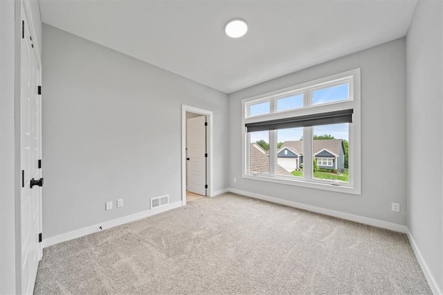 1709 SW Hightown Dr, Lees Summit, MO 64082 - carpeted spare room featuring baseboards