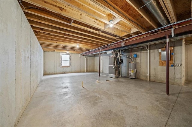 1709 SW Hightown Dr, Lees Summit, MO 64082 - below grade area featuring heating unit, gas water heater, and electric panel