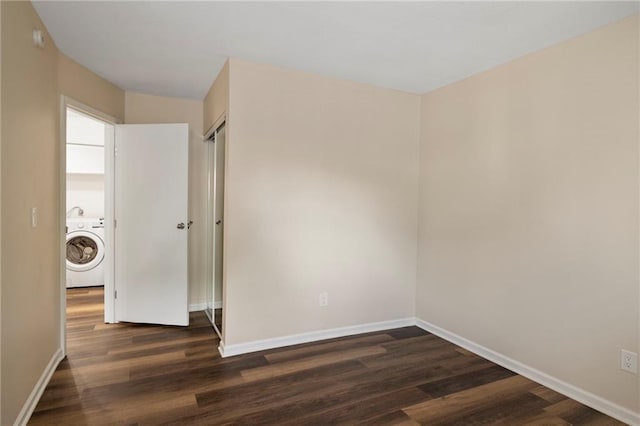 14107 W 88th St, Lenexa, KS 66215 - spare room featuring washer / dryer and dark wood-style floors