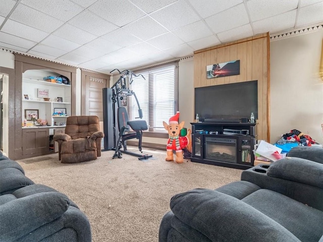 2517 Faraon St, Saint Joseph, MO 64501 - carpeted living area featuring built in shelves and a paneled ceiling