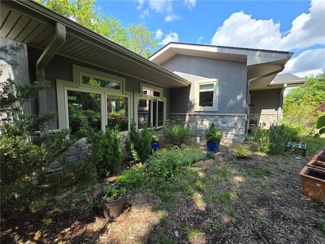 8050 SE Benner Lake Rd, Dearborn, MO 64439 - view of front facade with stone siding and stucco siding