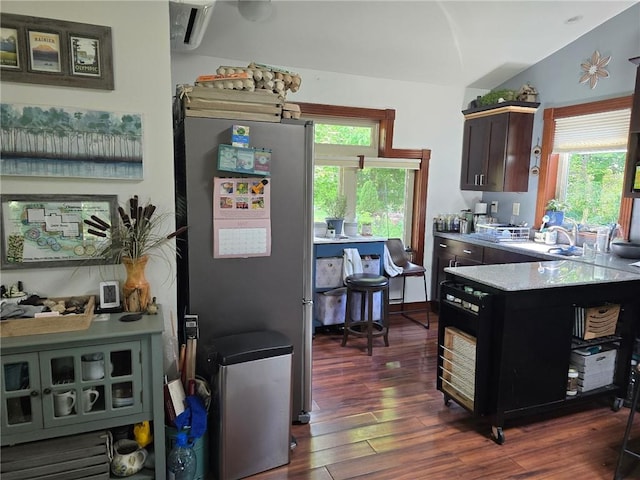 8050 SE Benner Lake Rd, Dearborn, MO 64439 - kitchen with freestanding refrigerator, a sink, dark wood finished floors, light countertops, and plenty of natural light