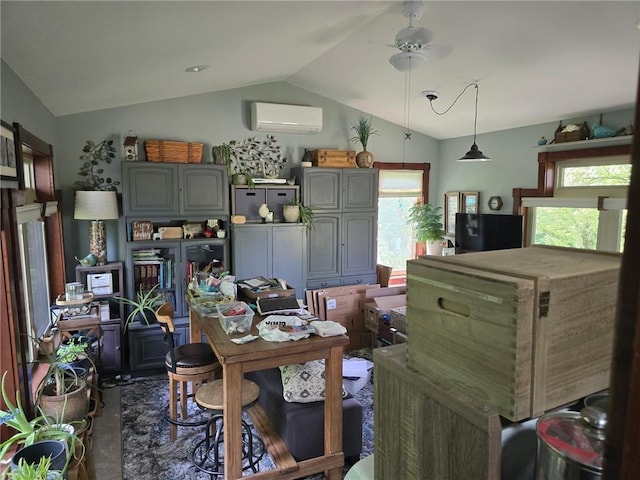 8050 SE Benner Lake Rd, Dearborn, MO 64439 - dining area with a wall unit AC, vaulted ceiling, plenty of natural light, and a ceiling fan