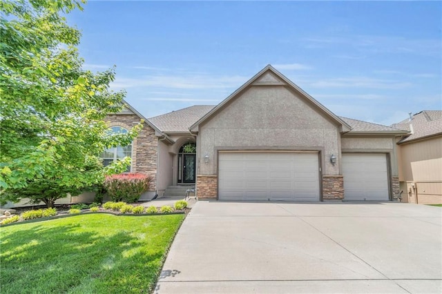 1210 Kettering Ln, Raymore, MO 64083 - view of front facade with stone siding, an attached garage, driveway, and a front yard