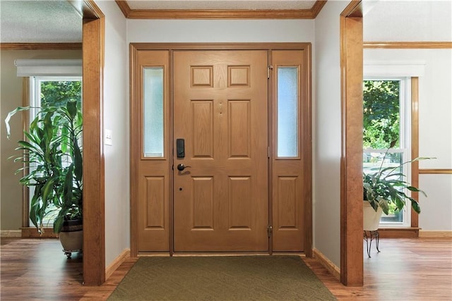 15206 W 85th St, Lenexa, KS 66219 - foyer entrance featuring wood finished floors, healthy amount of natural light, and crown molding