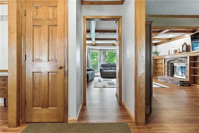 15206 W 85th St, Lenexa, KS 66219 - corridor featuring wood finished floors, ornamental molding, and beamed ceiling