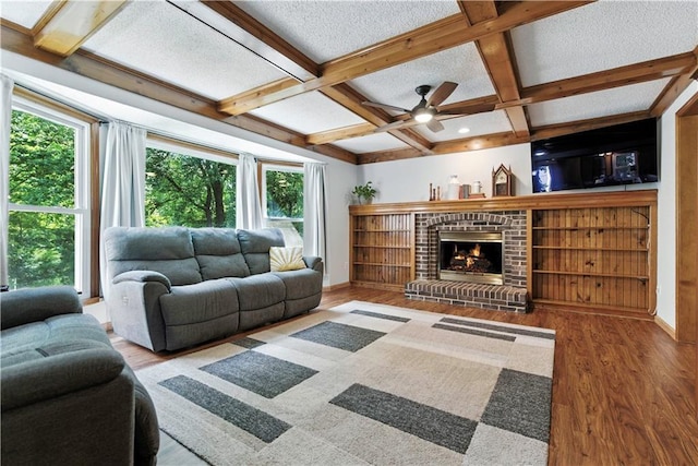 15206 W 85th St, Lenexa, KS 66219 - living area featuring plenty of natural light, wood finished floors, coffered ceiling, beam ceiling, and a textured ceiling