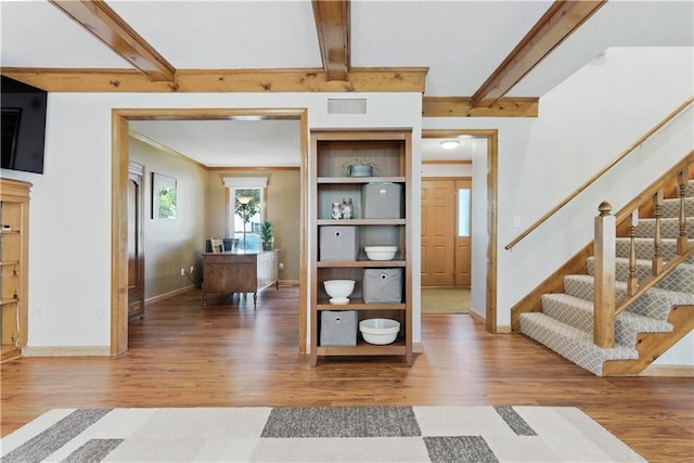 15206 W 85th St, Lenexa, KS 66219 - entrance foyer featuring wood finished floors, stairs, and beam ceiling