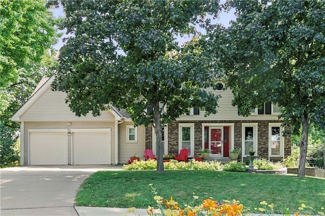 15206 W 85th St, Lenexa, KS 66219 - view of front of house with a garage, concrete driveway, and a front lawn