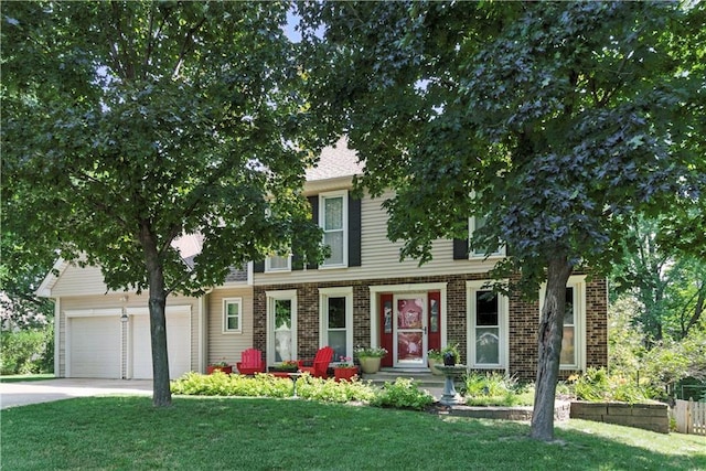 15206 W 85th St, Lenexa, KS 66219 - view of front facade with a front lawn, driveway, an attached garage, and brick siding