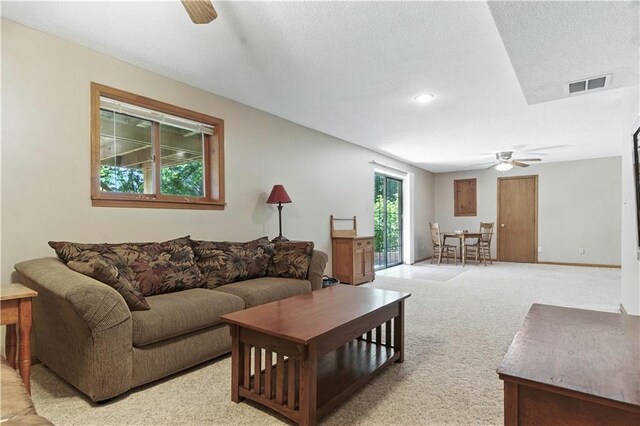 15206 W 85th St, Lenexa, KS 66219 - living room featuring a ceiling fan and light carpet