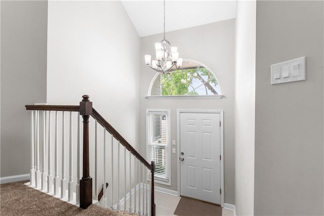 1021 NE Woodbury Ln, Lees Summit, MO 64086 - entryway with a chandelier, high vaulted ceiling, healthy amount of natural light, and baseboards