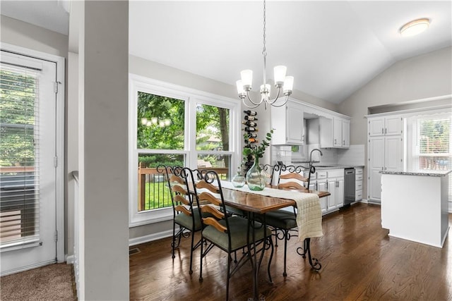 1021 NE Woodbury Ln, Lees Summit, MO 64086 - dining space featuring a chandelier, healthy amount of natural light, lofted ceiling, and dark wood-style flooring