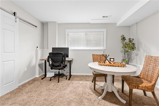 1021 NE Woodbury Ln, Lees Summit, MO 64086 - carpeted home office featuring a barn door and baseboards