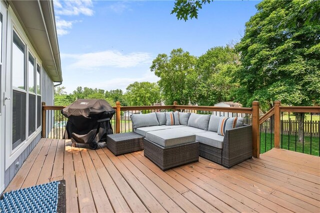 1021 NE Woodbury Ln, Lees Summit, MO 64086 - deck with outdoor lounge area, a grill, and view of wooded area